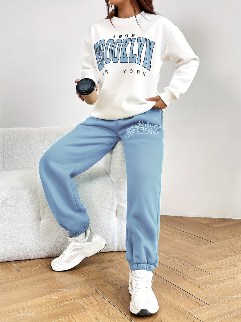 Ensemble d'entraînement deux pièces à imprimé lettre, sweat-shirt à manches longues à col ras du cou et pantalon de jogging long, vêtements pour femmes